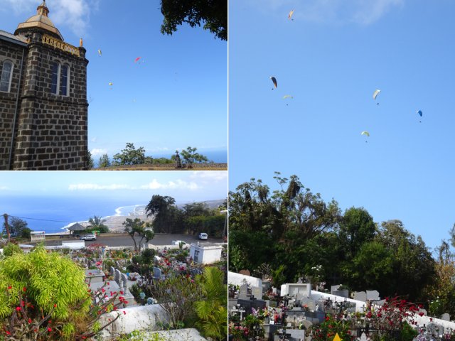 Le cimetière et l'église survolés par les parapentistes de l'île